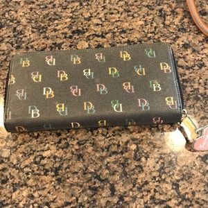 Dooney leather zip around. Matching bags listed.